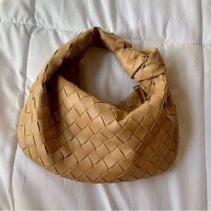 Knotted tan bag